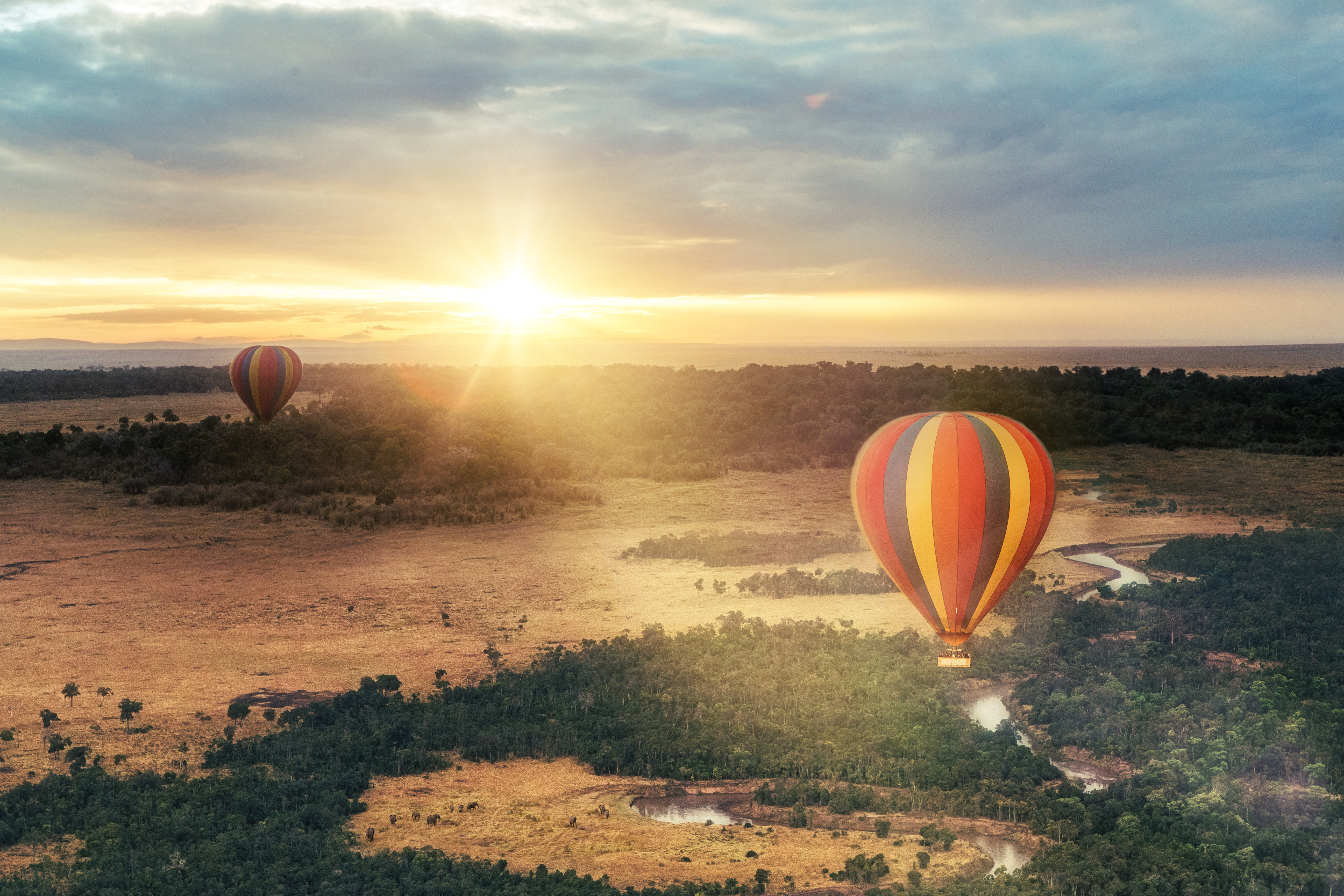 A hot air balloon hovering over the Maasai Mara National Reserve