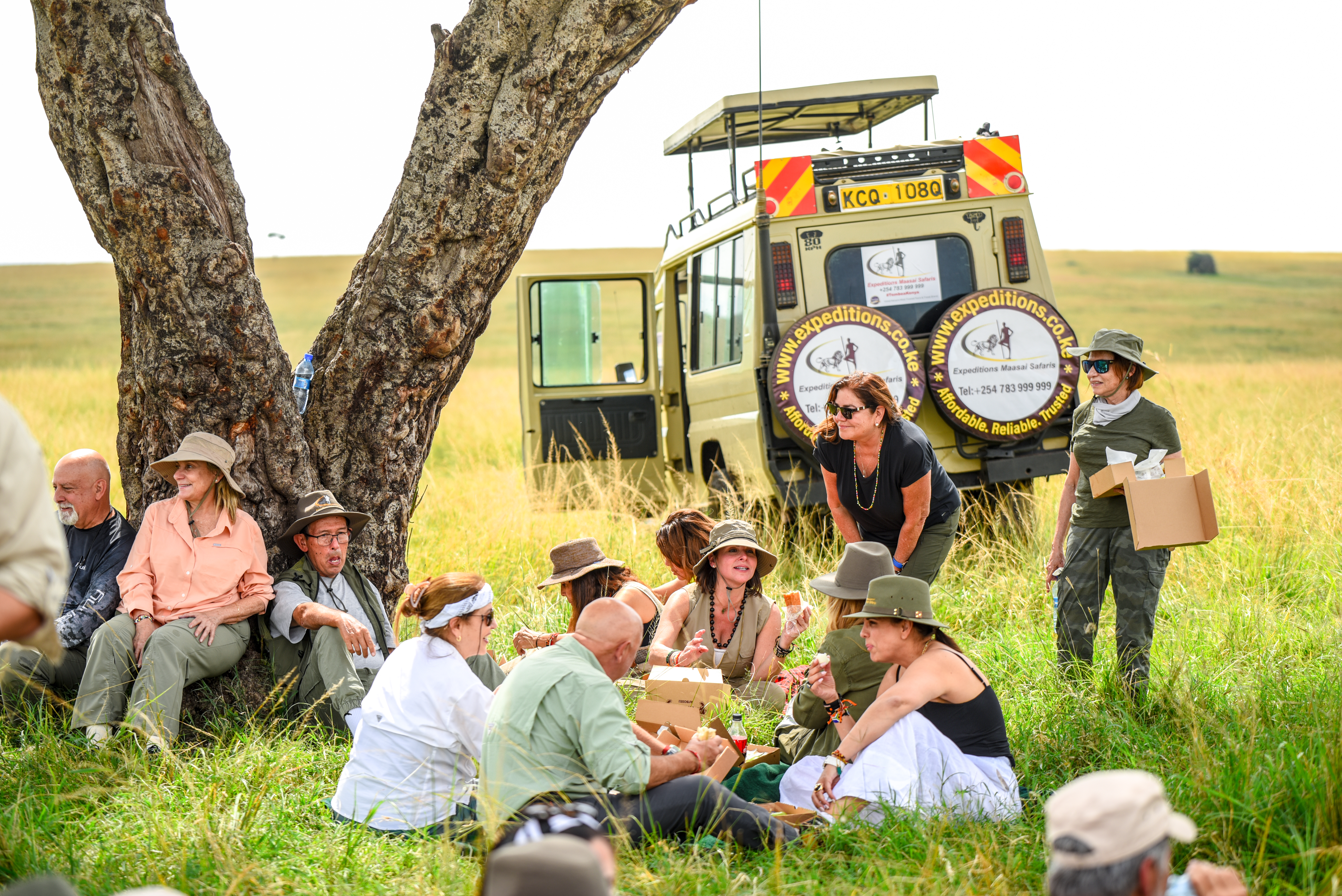 A group of tourists relaxing in the Mara after their safari