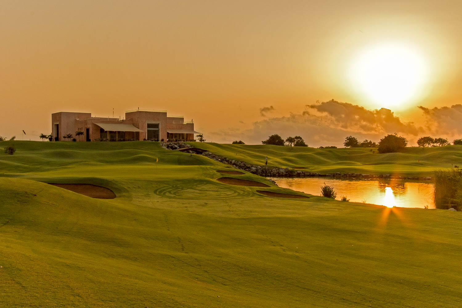 A picturesque view of the sun setting above the Vipingo Ridge PGA Baobab Golf Course
